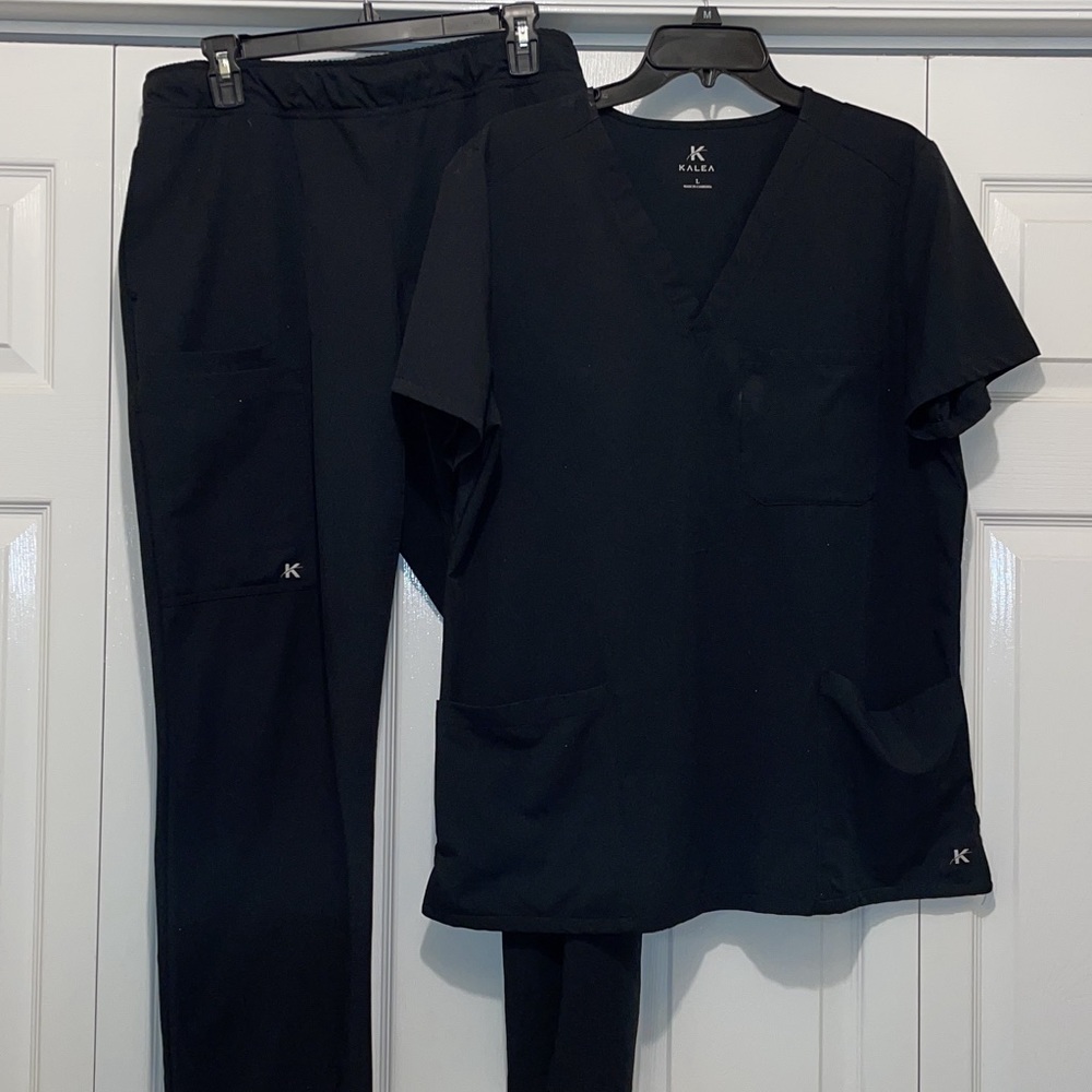 Kalea black scrub set size large. These are in good used condition.